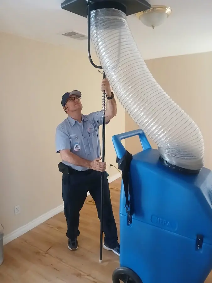 Furnace Tune-Up technician using HEPA equipment in East Highland Park